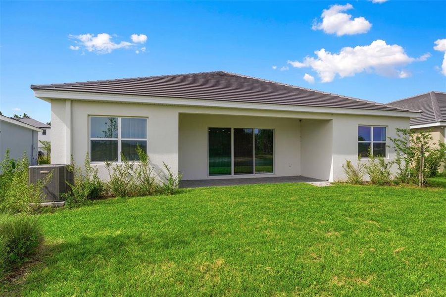 Exterior details and patio area of a home in Tamarack at Two Rivers, Zephyrhills (Image 33).