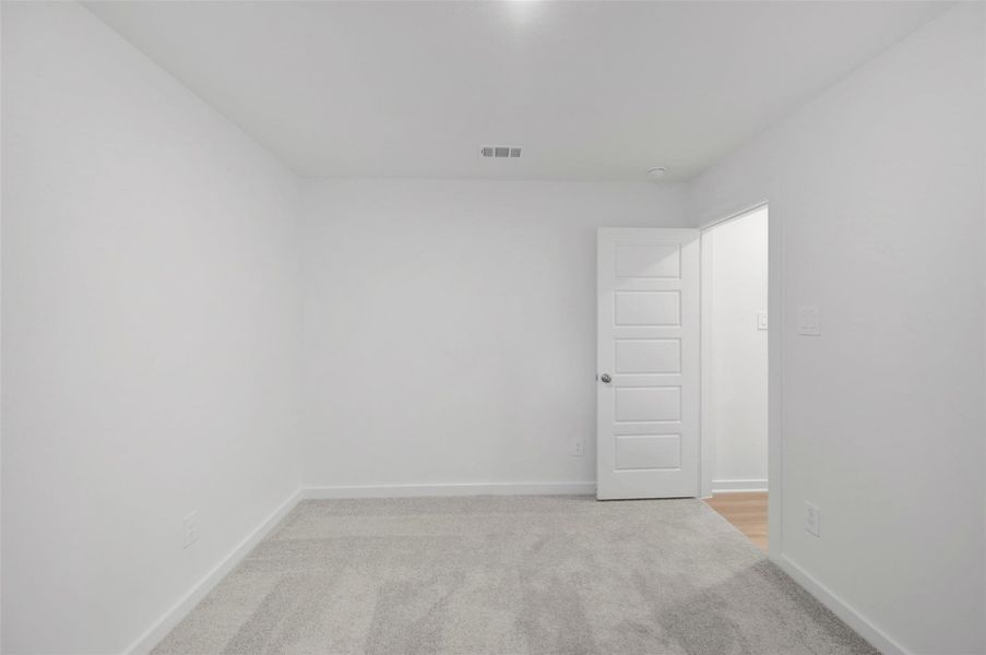 Spacious, unfurnished interior of a new home in Pinewood at Grand Texas, New Caney (Image 21).