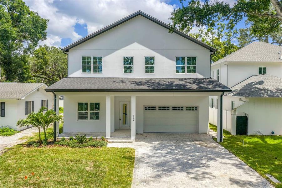 Front exterior of a new home in , St. Petersburg, FL, highlighting curb appeal (Image 8).