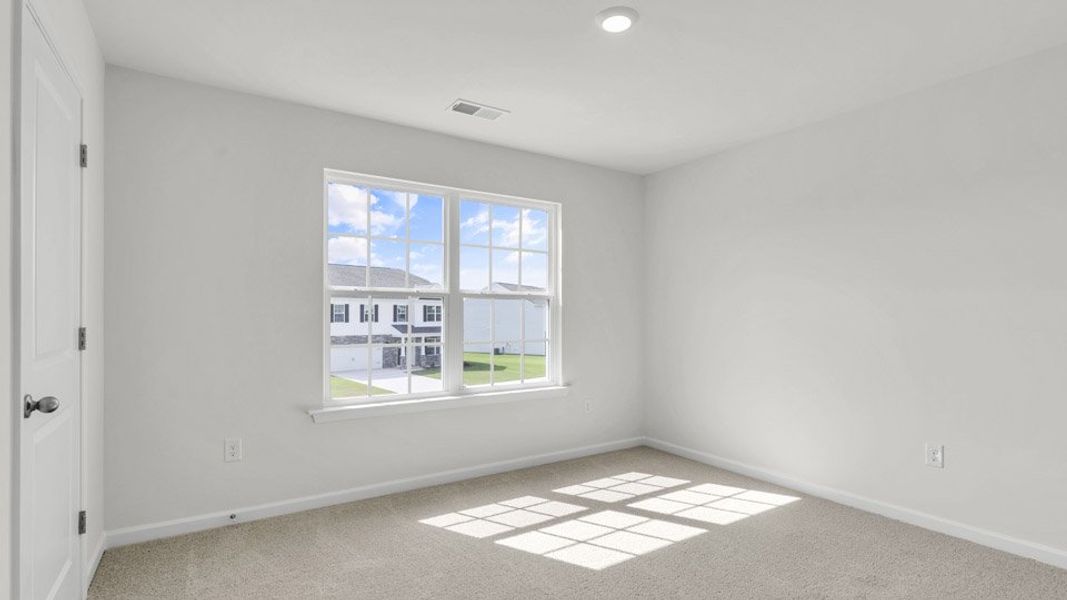 Spacious, unfurnished interior of a new home in The Preserve at Kinsley, Jamestown (Image 14). Spacious, unfurnished interior of a new home in The Preserve at Kinsley, Jamestown (Image 14).