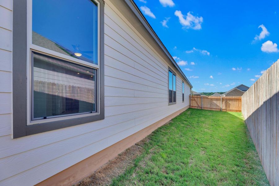 Front exterior of a new home in Retreat at San Gabriel, Georgetown, TX, highlighting curb appeal (Image 1).