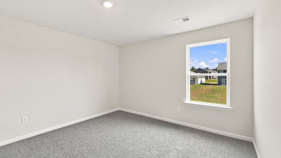 Spacious, unfurnished interior of a new home in Bentley Park, Greenwood (Image 22).