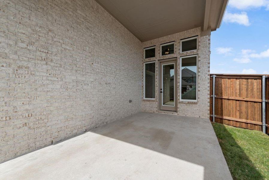 Exterior details and patio area of a home in Trails at Cottonwood Creek, Fate (Image 3).