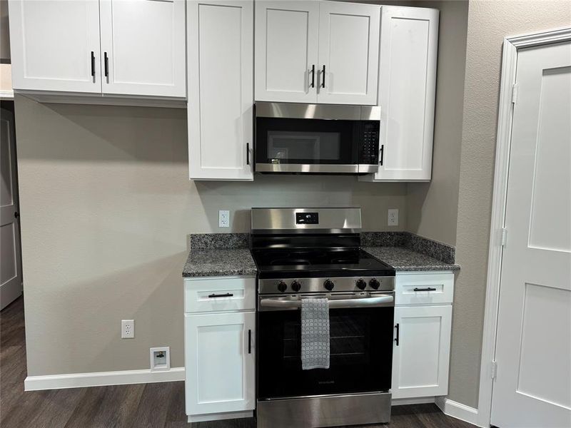 Kitchen has solid wood cabinets with soft close doors and drawers.  Stainless appliance