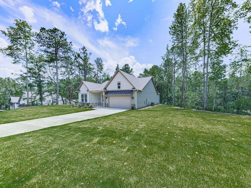 Front exterior of a new home in , Ellijay, GA, highlighting curb appeal (Image 22).