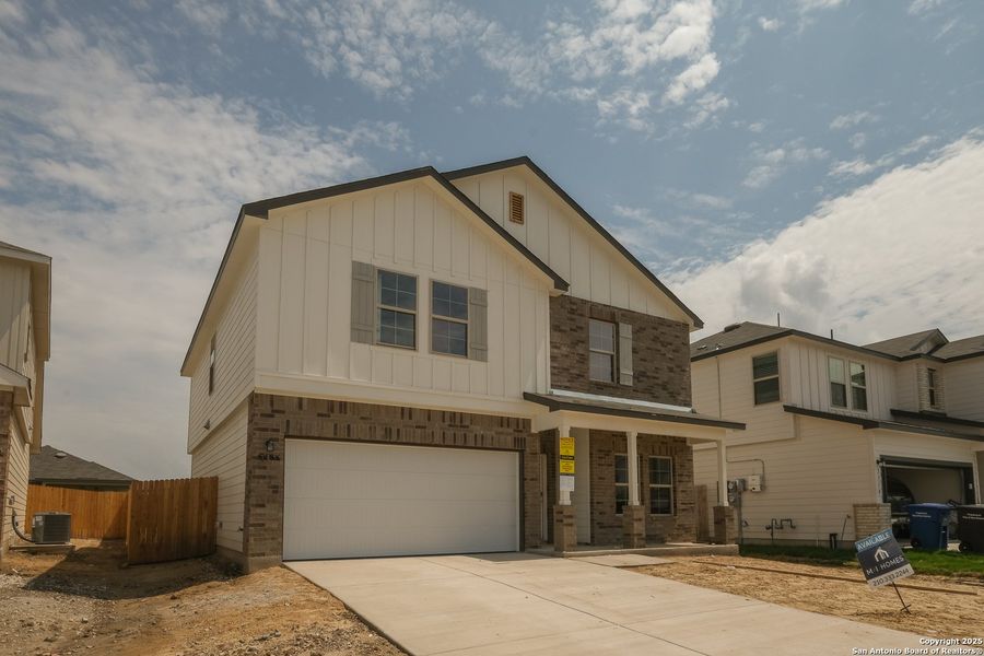 Front exterior of a new home in Blue Ridge Ranch, San Antonio, TX, highlighting curb appeal (Image 18). Front exterior of a new home in Blue Ridge Ranch, San Antonio, TX, highlighting curb appeal (Image 18).