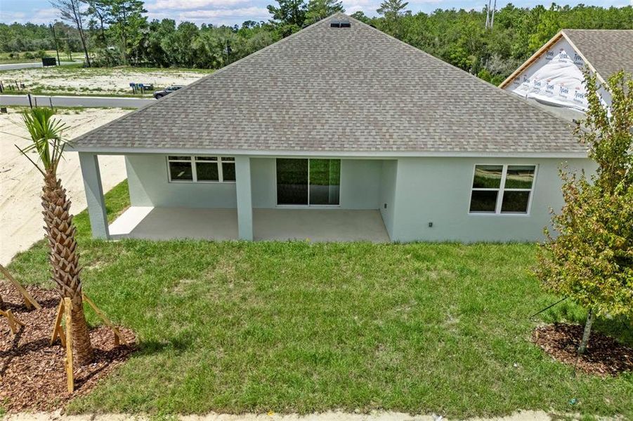 Front exterior of a new home in Trinity Gardens, Deland, FL, highlighting curb appeal (Image 18). Front exterior of a new home in Trinity Gardens, Deland, FL, highlighting curb appeal (Image 18).