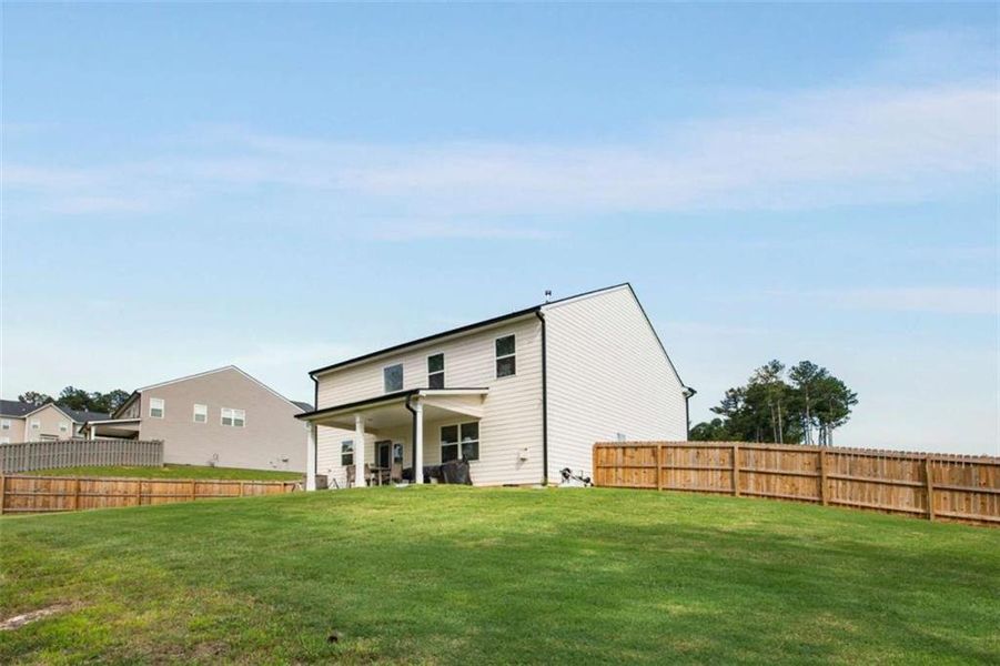Front exterior of a new home in Stillwater Springs, Dacula, GA, highlighting curb appeal (Image 22). Front exterior of a new home in Stillwater Springs, Dacula, GA, highlighting curb appeal (Image 22).