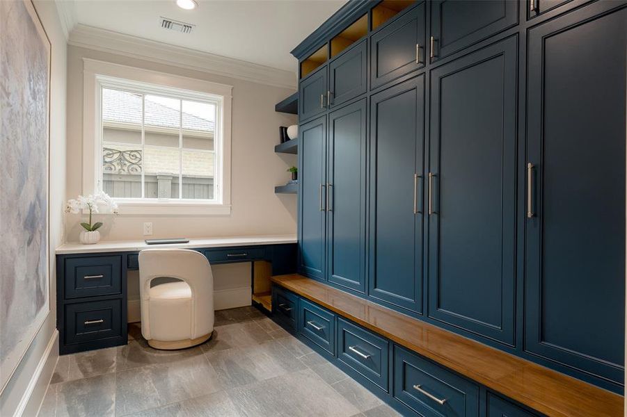 Mud-room with desk area.