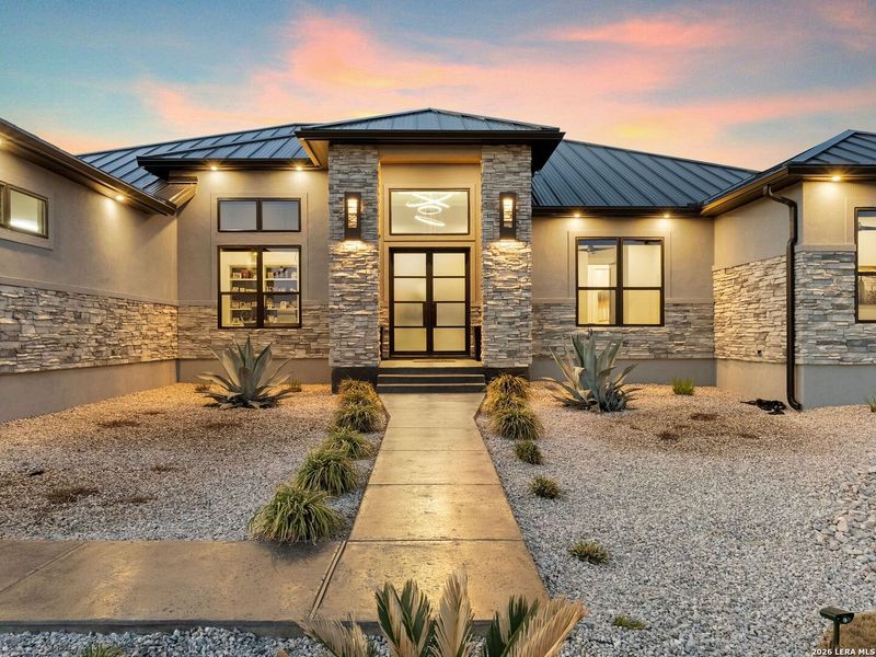 Front exterior of a new home in , Canyon Lake, TX, highlighting curb appeal (Image 23).