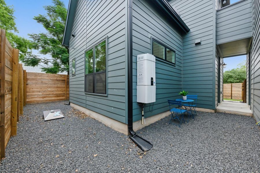 View of home's exterior with water heater View of home's exterior with water heater