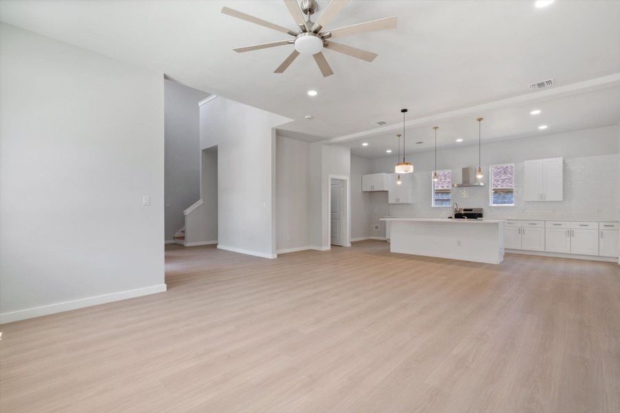 An airy great room combines a spacious living area with a contemporary kitchen, perfect for entertaining.