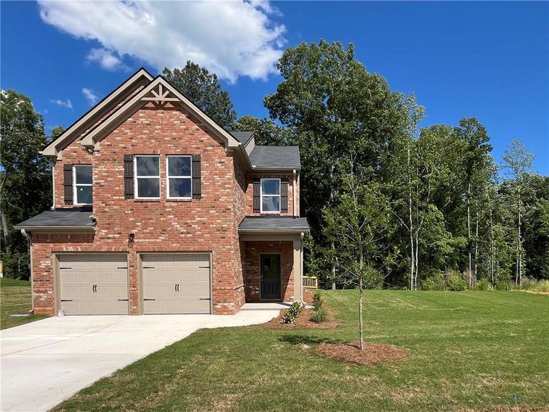 Front exterior of a new home in River Walk Farm, Covington, GA, highlighting curb appeal (Image 17). Front exterior of a new home in River Walk Farm, Covington, GA, highlighting curb appeal (Image 17).