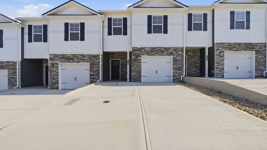 Front exterior of a new home in The Arbor Townhomes, Kingsport, TN, highlighting curb appeal (Image 2). Front exterior of a new home in The Arbor Townhomes, Kingsport, TN, highlighting curb appeal (Image 2).