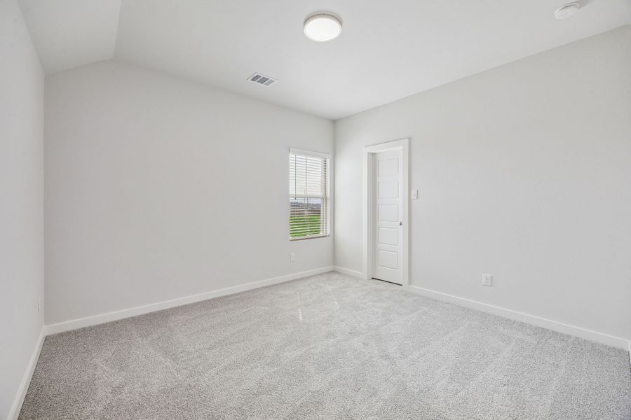 Bedroom in the Stanley II home plan by Trophy Signature Homes – REPRESENTATIVE PHOTO
