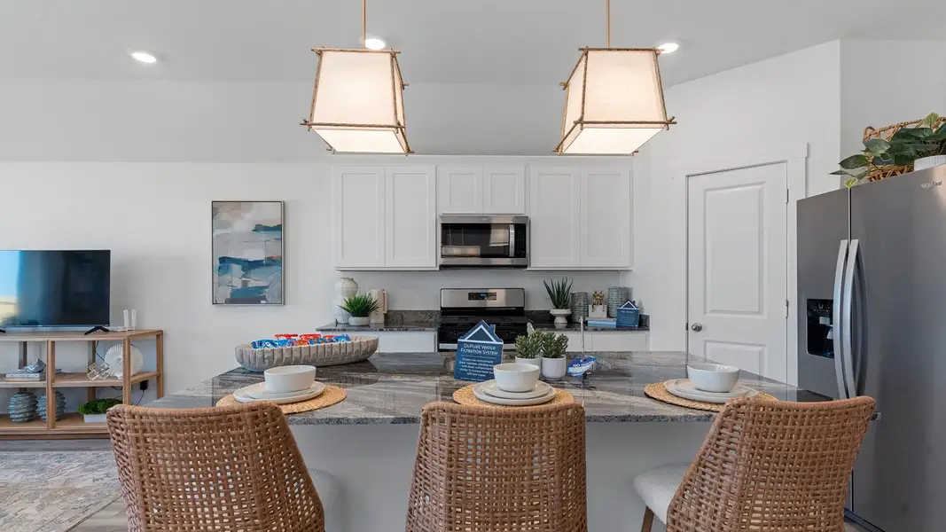 Furnished interior view inside a new home in Caldwell Crossing, Iowa Colony (Image 3).