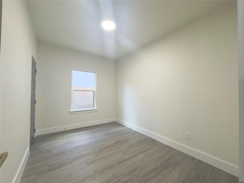 Spare room with hardwood / wood-style flooring