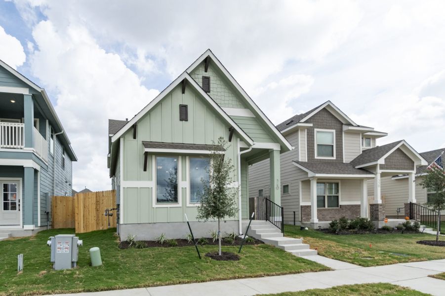 Front exterior of a new home in Blanco Vista, San Marcos, TX, highlighting curb appeal (Image 27).