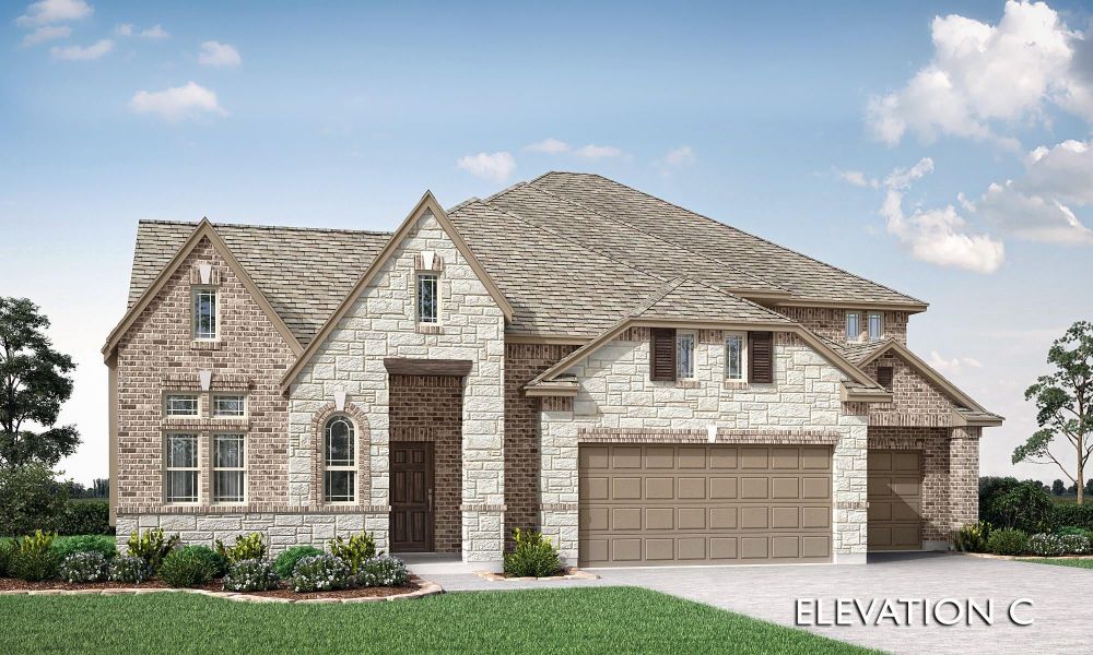 Two-story home with brick and stone exterior, three-car garage, and arched entry door, Elevation C Two-story home with brick and stone exterior, three-car garage, and arched entry door, Elevation C