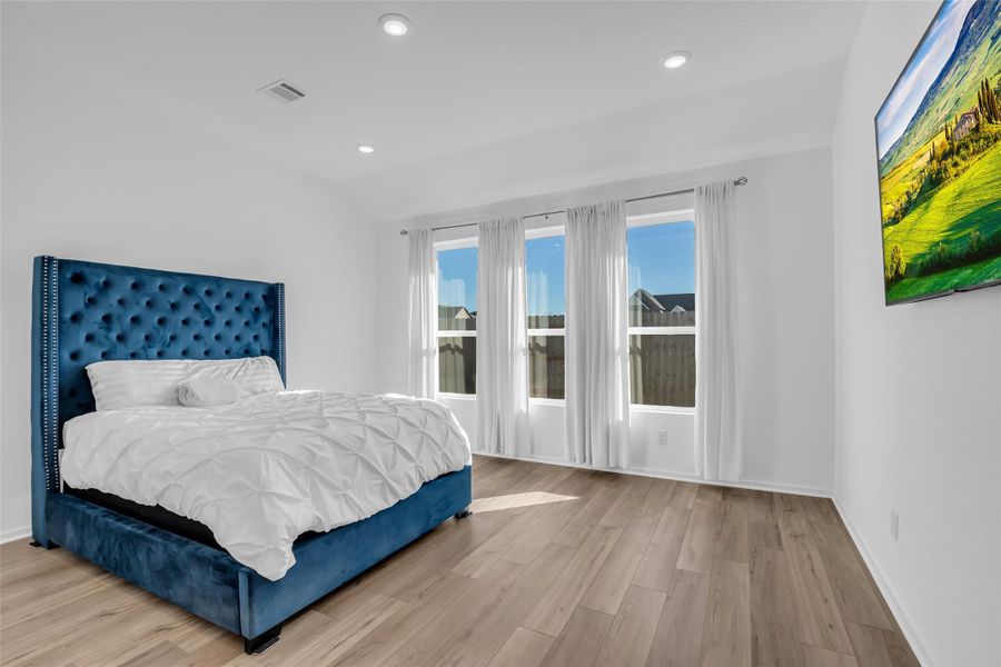 Primary Suite Retreat: A spacious downstairs sanctuary filled with natural light and calm, offering privacy away from the main living areas. Designed for ease and comfort, this suite anchors the home with quiet separation and everyday livability. Primary Suite Retreat: A spacious downstairs sanctuary filled with natural light and calm, offering privacy away from the main living areas. Designed for ease and comfort, this suite anchors the home with quiet separation and everyday livability.