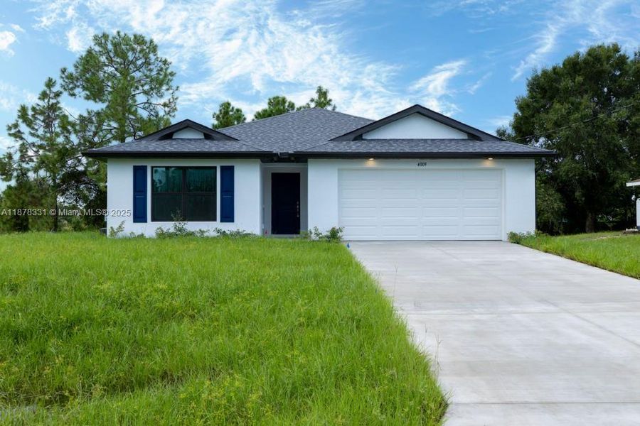 Front exterior of a new home in , Lehigh Acres, FL, highlighting curb appeal (Image 2). Front exterior of a new home in , Lehigh Acres, FL, highlighting curb appeal (Image 2).