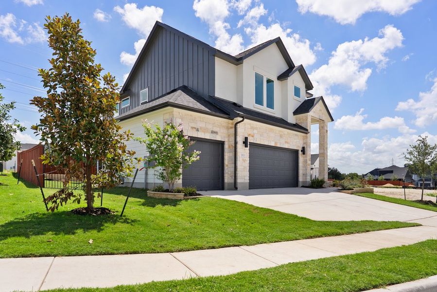 Front exterior of a new home in Foxfield, Austin, TX, highlighting curb appeal (Image 2). Front exterior of a new home in Foxfield, Austin, TX, highlighting curb appeal (Image 2).