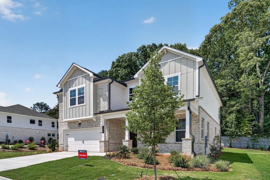 Front exterior of a new home in Nichols Farm, Dacula, GA, highlighting curb appeal (Image 25).