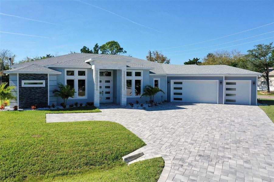 Front exterior of a new home in , Palm Coast, FL, highlighting curb appeal (Image 31). Front exterior of a new home in , Palm Coast, FL, highlighting curb appeal (Image 31).