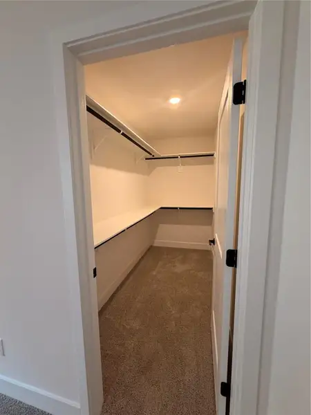 Primary Walk-in Closet Primary Walk-in Closet