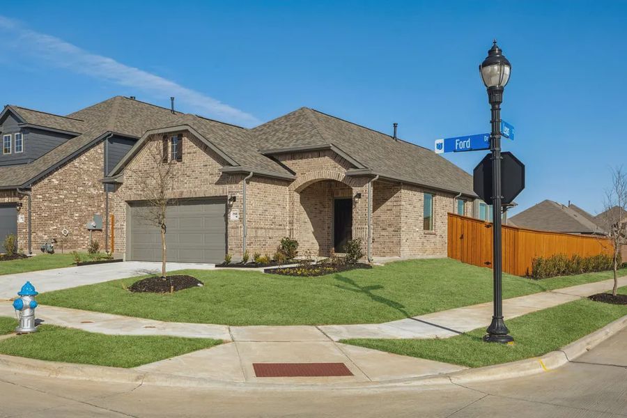 Front exterior of a new home in Heartland 40's, Heartland, TX, highlighting curb appeal (Image 2). Front exterior of a new home in Heartland 40's, Heartland, TX, highlighting curb appeal (Image 2).