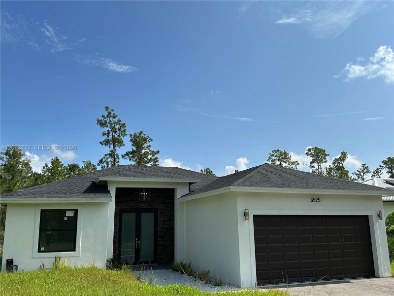 Front exterior of a new home in , Naples, FL, highlighting curb appeal (Image 2). Front exterior of a new home in , Naples, FL, highlighting curb appeal (Image 2).