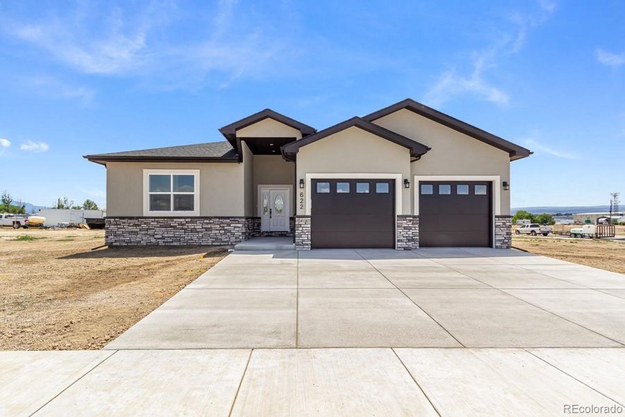 Front exterior of a new home in , Montrose, CO, highlighting curb appeal (Image 25). Front exterior of a new home in , Montrose, CO, highlighting curb appeal (Image 25).