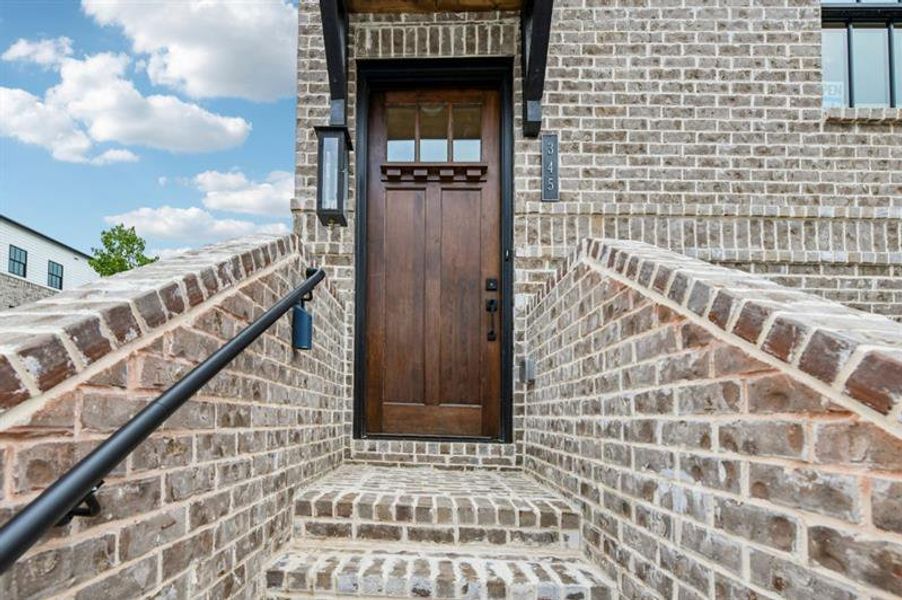 Exterior details and patio area of a home in Skyview On Broad, Sugar Hill (Image 28).