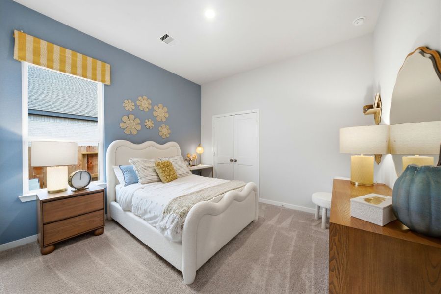 A bedroom with a bed and a desk. A bedroom with a bed and a desk.