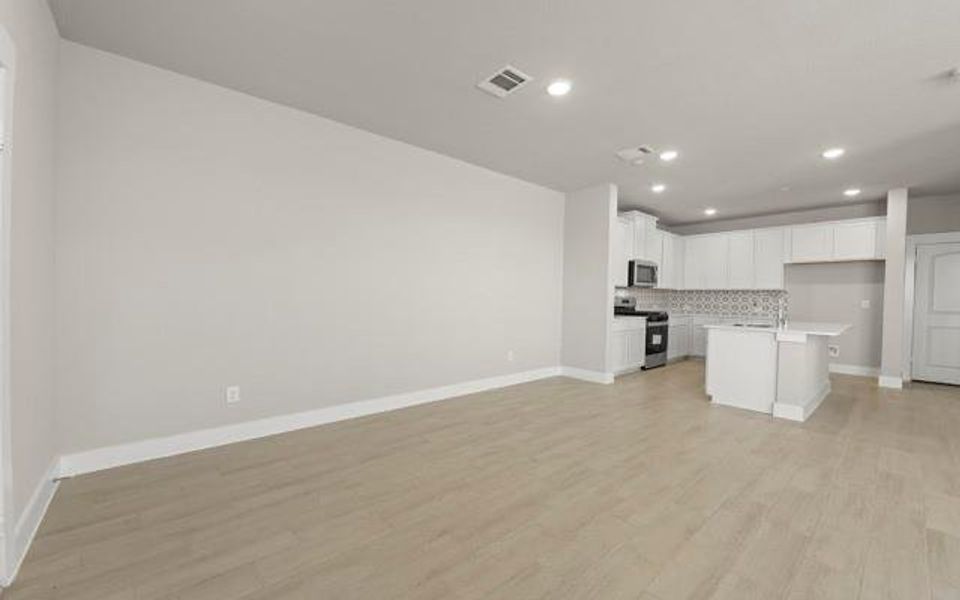 Dining Room is conveniently opened to the kitchen and living room. Space will include dining room and dining chairs.