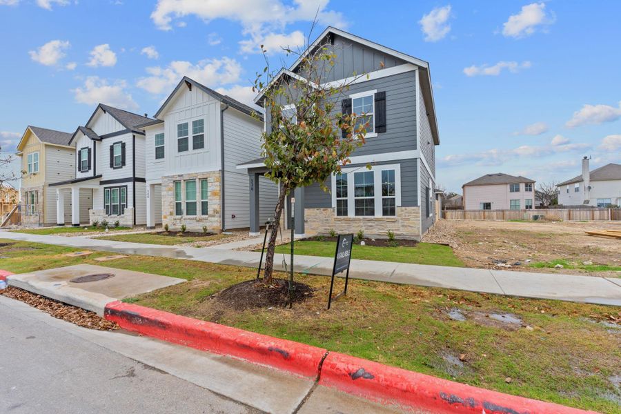 Front exterior of a new home in Retreat at Hero Way, Leander, TX, highlighting curb appeal (Image 20).