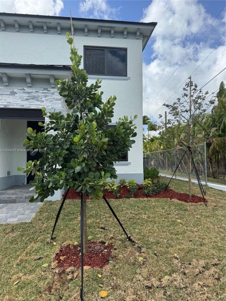 Front exterior of a new home in , Homestead, FL, highlighting curb appeal (Image 11).