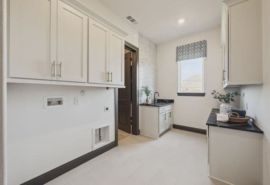 Plan 5058 laundry room - staged - 15 of 25 Plan 5058 laundry room - staged - 15 of 25