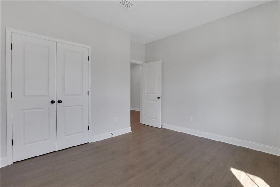Spacious, unfurnished interior of a new home in The Paddocks at Doc Hughes, Buford (Image 41).