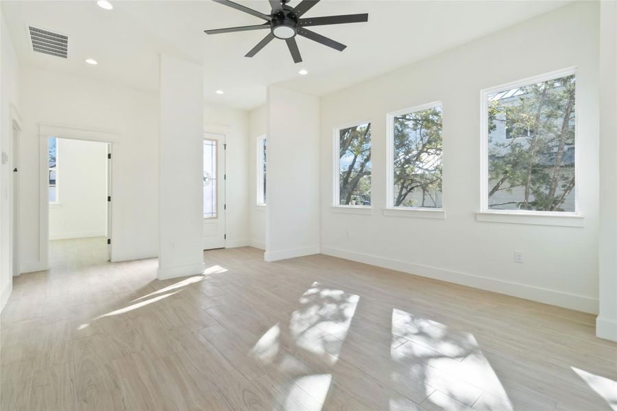 Living area wit view of front entry way and dedicated office Living area wit view of front entry way and dedicated office