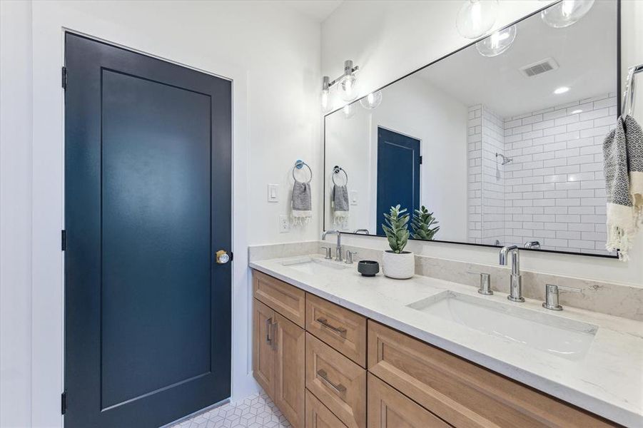 Charming Jack & Jill bathroom with access to both secondary bedrooms.