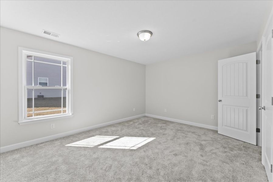 Representative unfurnished interior of a home built from the Addington by Enchanted Homes in Davis Heights, Inman (Image 46).