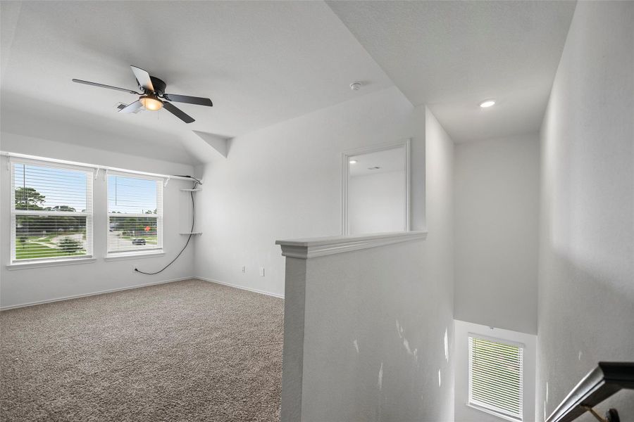 Large upstairs flex space perfect for a game room or media area Large upstairs flex space perfect for a game room or media area