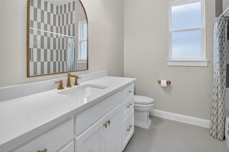 Full bath featuring vanity and shower / tub combo