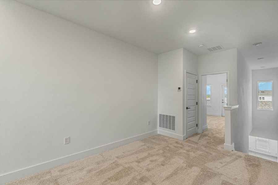 Representative unfurnished interior of a home built from the Edison by Rockwell Homes in Harvest at Ovation - Townhomes, Winter Garden (Image 76). Representative unfurnished interior of a home built from the Edison by Rockwell Homes in Harvest at Ovation - Townhomes, Winter Garden (Image 76).