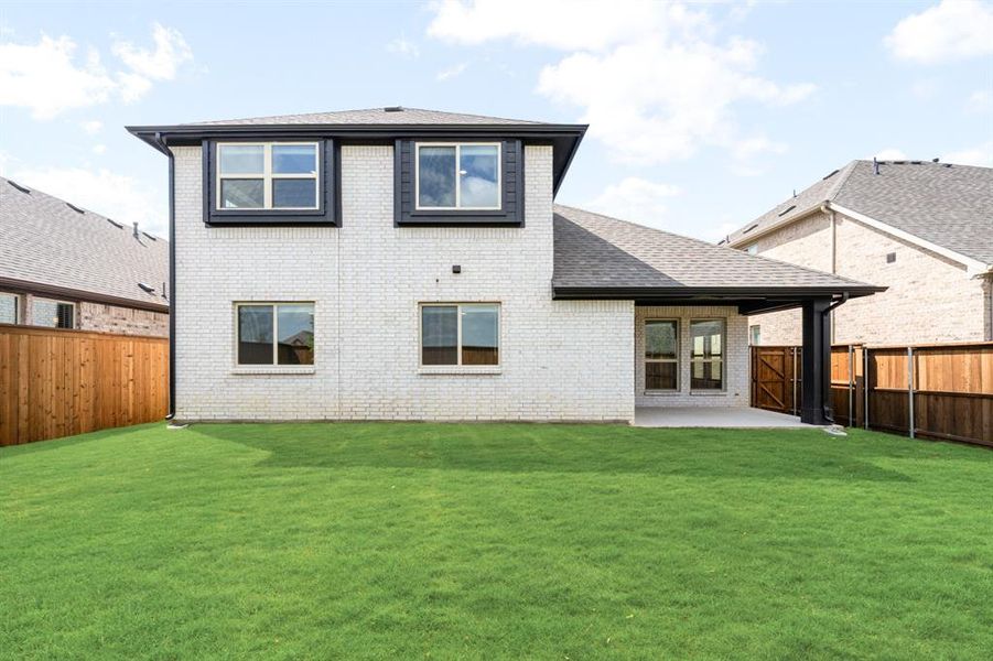 Exterior details and patio area of a home in Creekview Meadows, Pilot Point (Image 3).