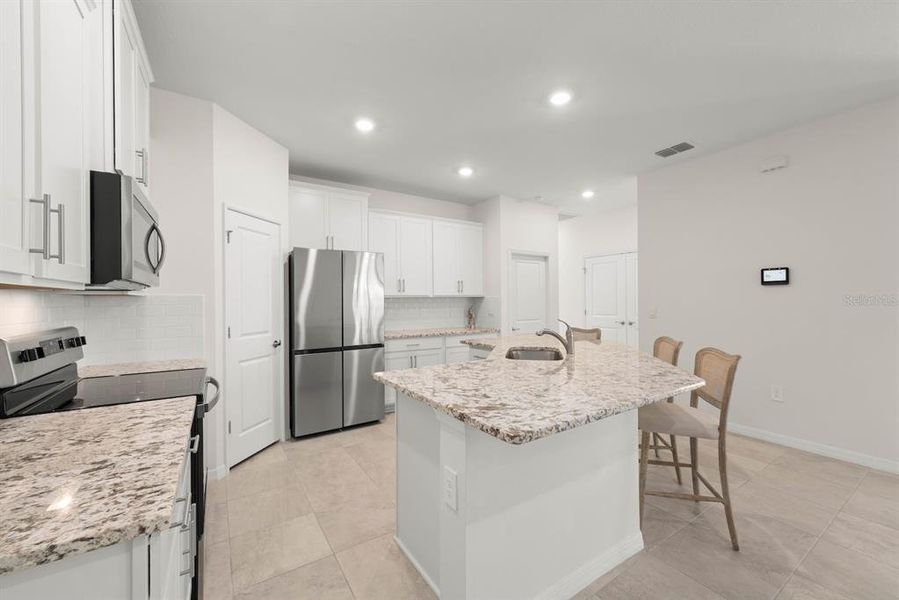 Furnished interior view inside a new home in Star Farms at Lakewood Ranch, Bradenton (Image 7).