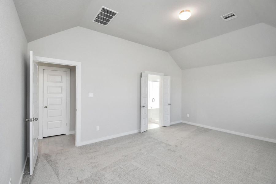 Unwind in style in this remarkable primary suite after a long day! Revel in the luxury of plush carpet, warm paint tones, soaring ceilings, and expansive windows. Sample photo of completed home with similar floor plan. Actual colors and selections may vary. Unwind in style in this remarkable primary suite after a long day! Revel in the luxury of plush carpet, warm paint tones, soaring ceilings, and expansive windows. Sample photo of completed home with similar floor plan. Actual colors and selections may vary.