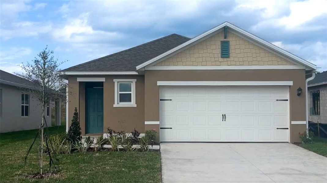 Front exterior of a new home in Campbell Crossing, Port Orange, FL, highlighting curb appeal (Image 1).