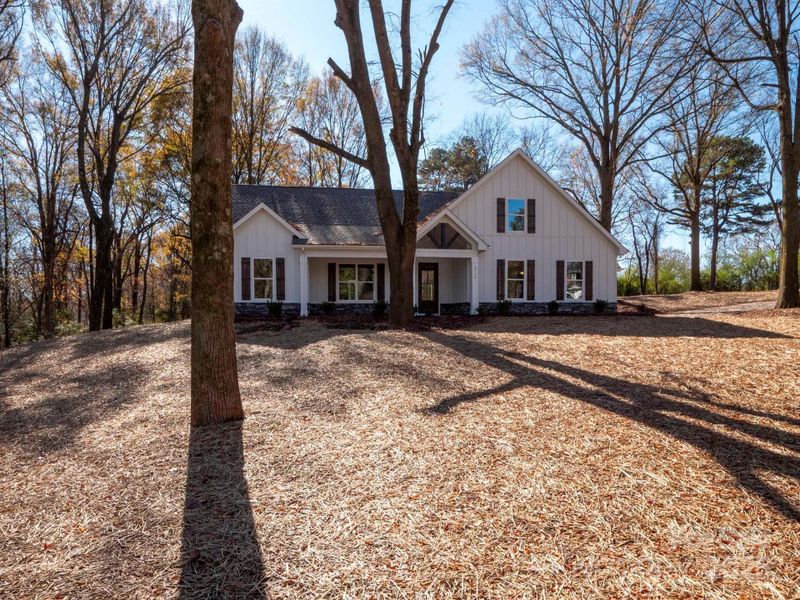 Front exterior of a new home in , Monroe, NC, highlighting curb appeal (Image 27). Front exterior of a new home in , Monroe, NC, highlighting curb appeal (Image 27).